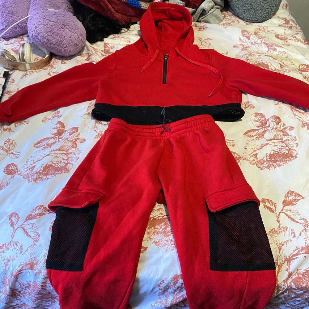 Red and black net track suit